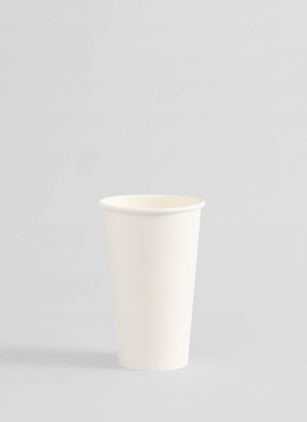 A plain white paper cup centered on a light gray studio background.