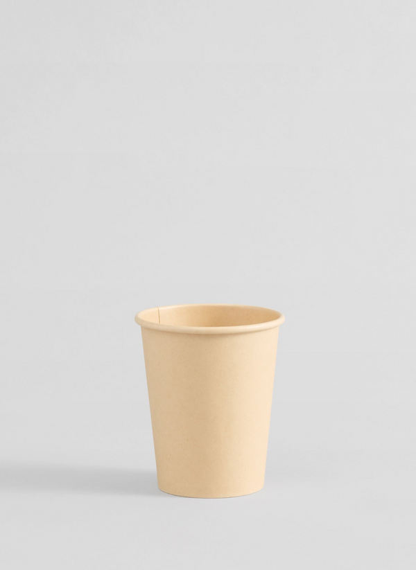 Compostable bamboo paper cup on a light gray background