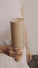 stack of bamboo cups with a cappuccino